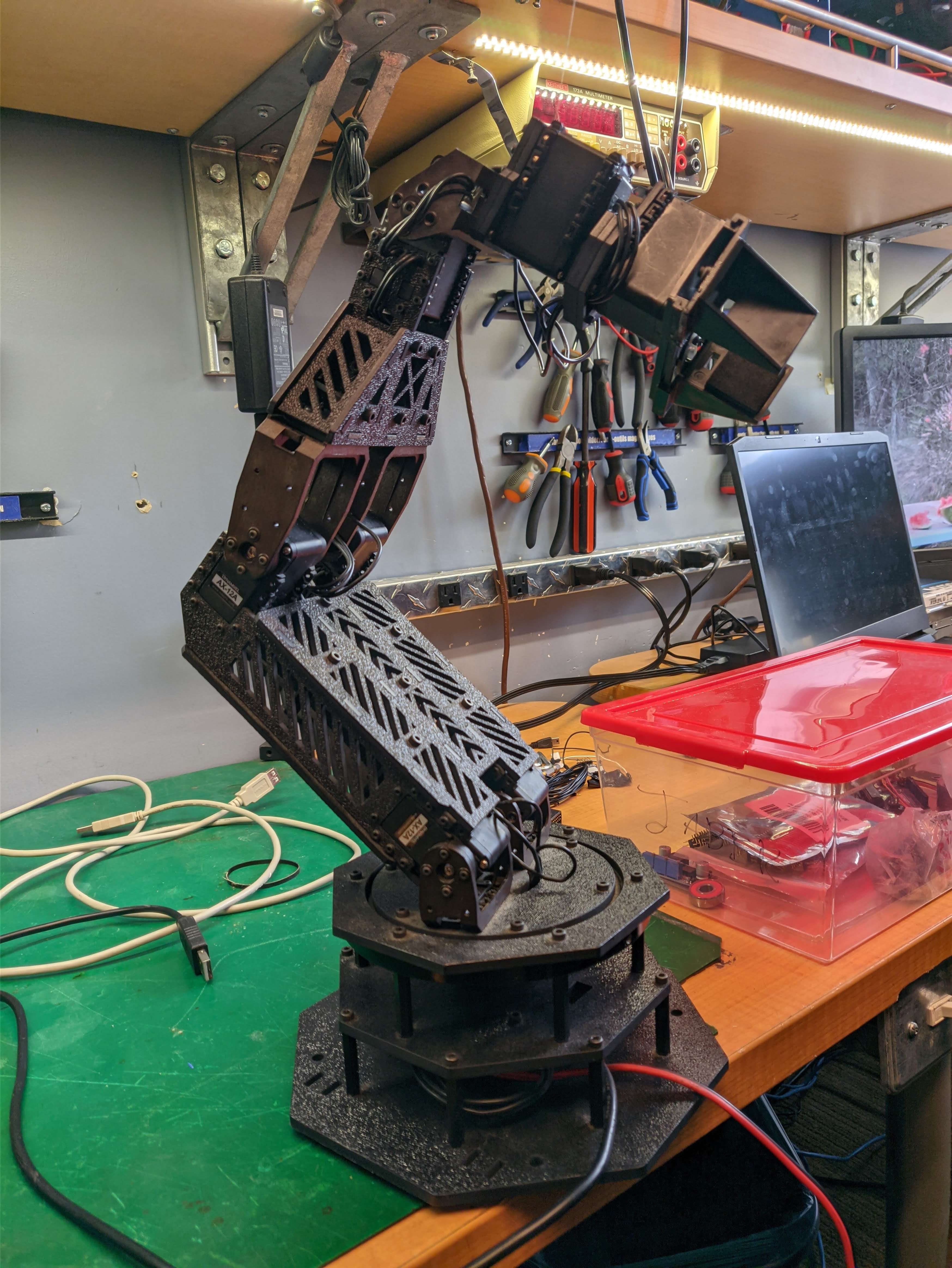 A small robotic arm with a gripper.